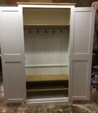 A white hallway storage cupboard with coat hooks and three shelves, displayed open, showing internal layout