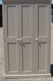 A traditional style solid pine wood storage cupboard with two doors and a flat top, featuring wooden knobs and multiple internal shelves.