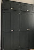 A shaker style 4 door hall coat and shoe storage cupboard with wooden knobs and top box storage.