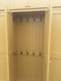 A yellow 5-door hall coat and shoe storage cupboard with a top box and additional storage.