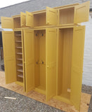 A yellow 5-door hall coat and shoe storage cupboard with a top box and additional storage.