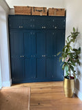 A blue 5-door hall coat and shoe storage cupboard with a top box and additional storage.
