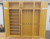 A yellow 5-door hall coat and shoe storage cupboard with a top box and additional storage.