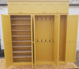 A yellow 5-door hall coat and shoe storage cupboard with a top box and additional storage.