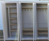 A white 6-door hall coat and shoe storage cupboard with a top box and additional storage.