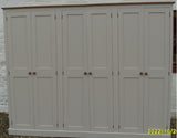 A white 6-door hall coat and shoe storage cupboard with a top box and additional storage.