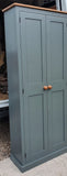 A downpipe 6-door hall coat and shoe storage cupboard with a top box and additional storage.